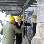 Inspecting the clock face repair as part of a major conservation project on the tower
